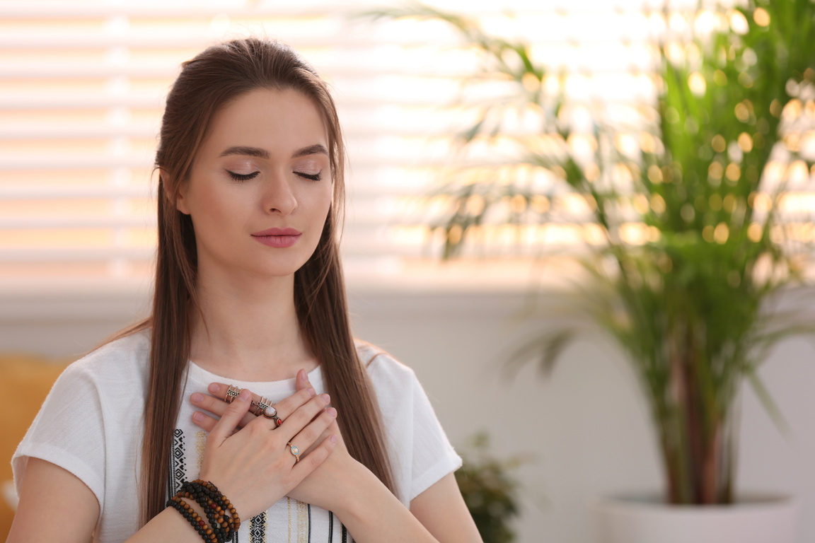 Young Woman during Self-Healing Session in  Room