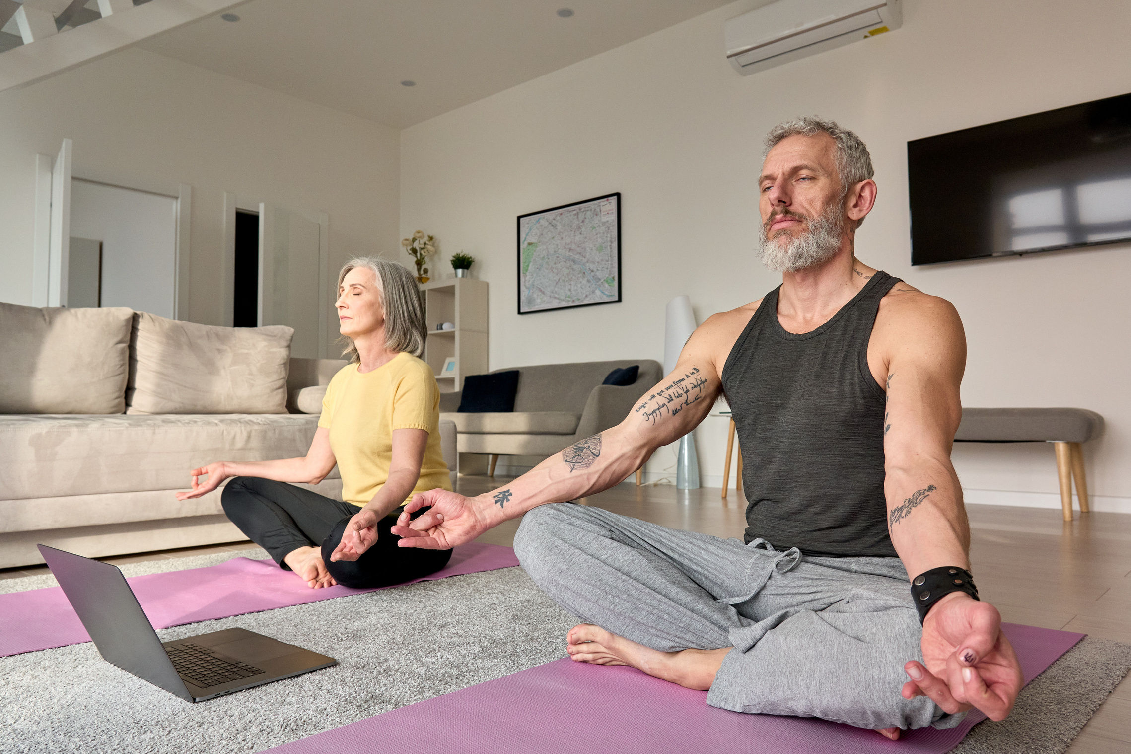 Senior Couple Doing Online Yoga 