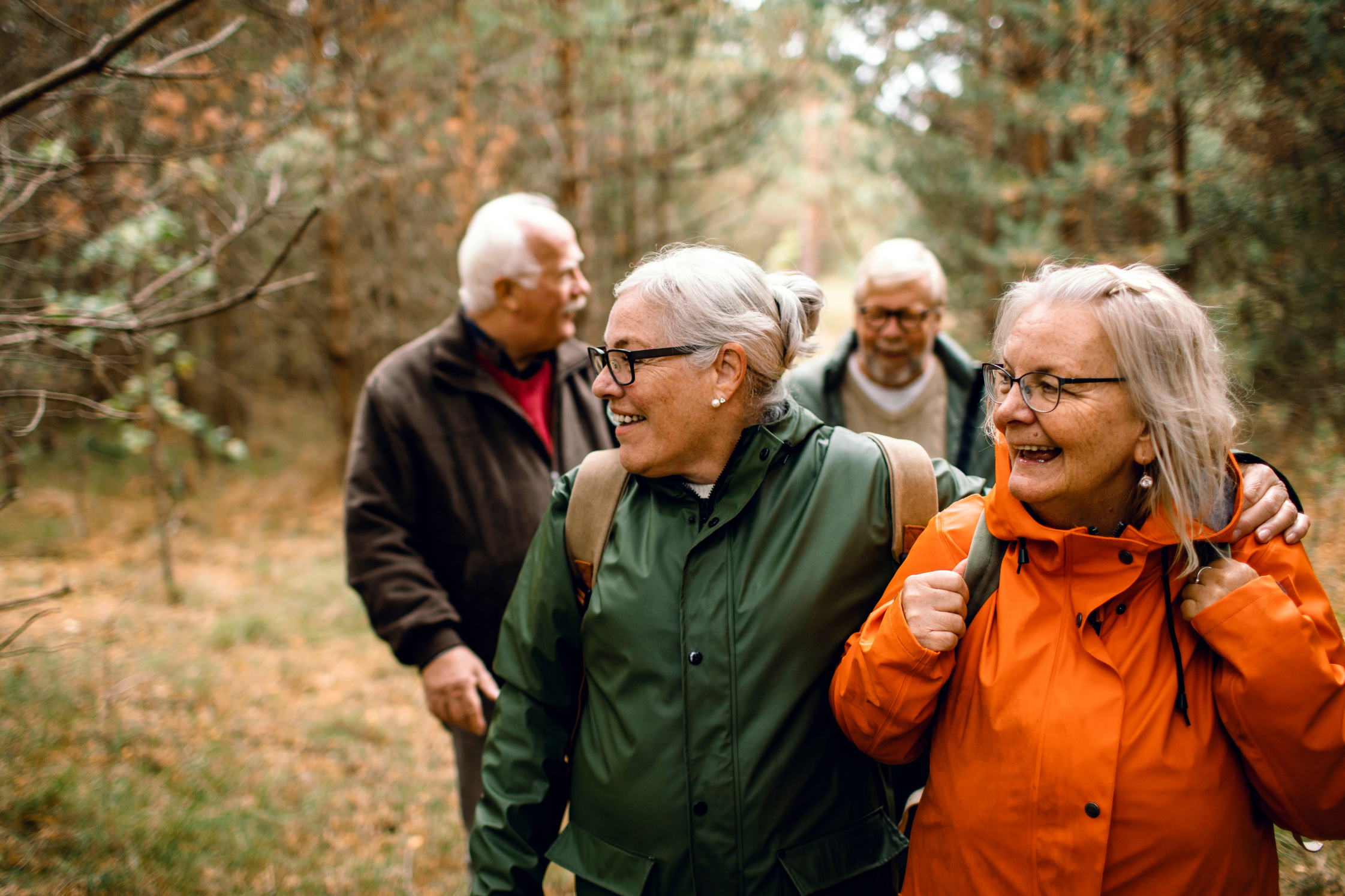 Seniors hiking through the foerst