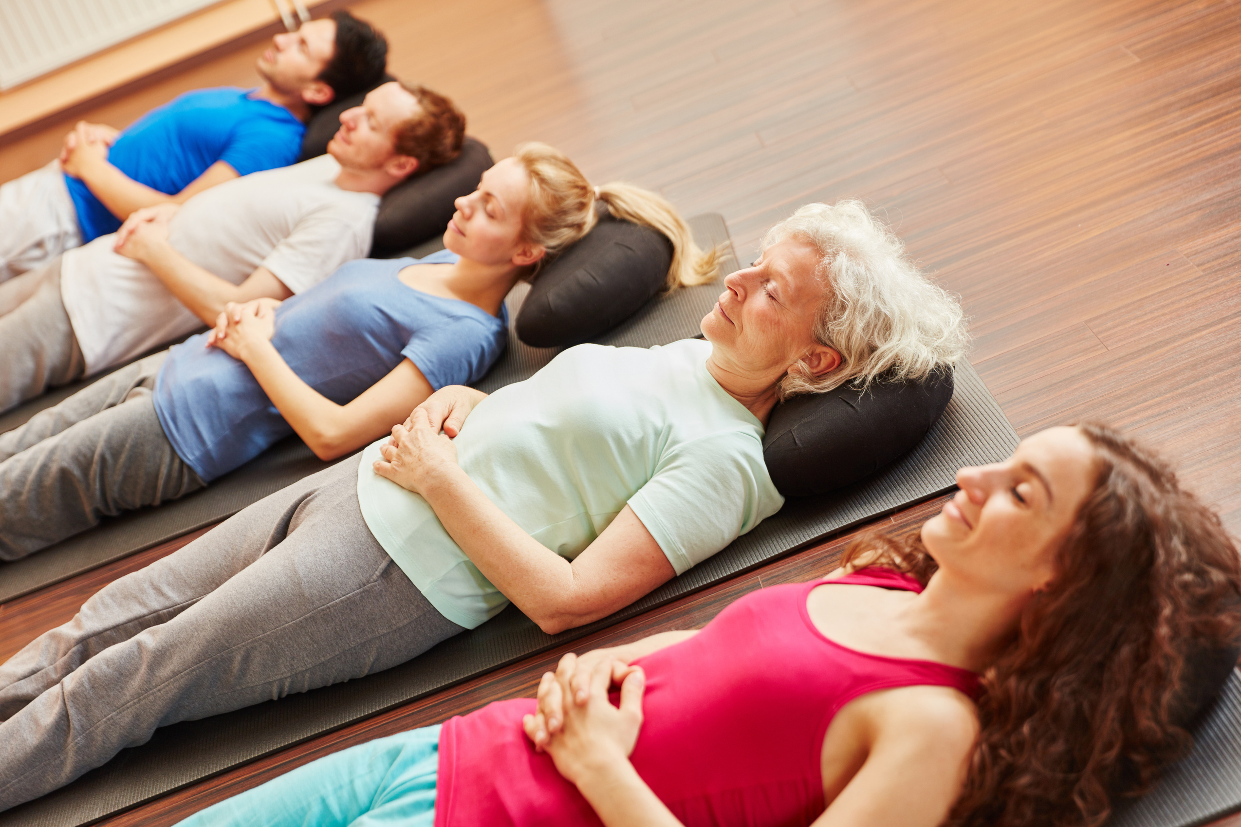 Senior with a Group Meditating